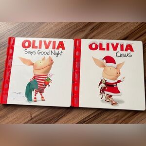 Olivia Claus & Olivia Says Good Night hard cover books.